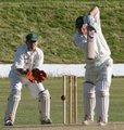 Paul Danson shows the bowler the makers name on his bat