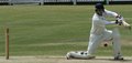 Bruce Martin drives the ball square of the wicket