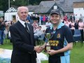League President Brian Standing presents Netherfield captain Marc Hadwin with the cup