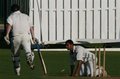Javaid Hussain on his knees running out Mark Emery