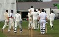Chris Miller is mobbed by his team mates on taking all ten Carnforth wickets