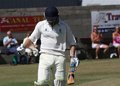 Karl Cross celebrates reaching his century
